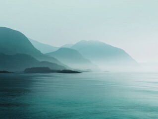 Minimalist Landscape Alaskan Fjord Tranquil Waters Serene Mountain Silhouettes Muted Teal Tones Calm Inlet Foggy Atmosphere Outdoor Nature Scene Pacific Northwest Scenic View