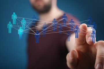 Abstract conceptual image of a person touching a network of connected human figures, representing concepts like connection, community, digital t