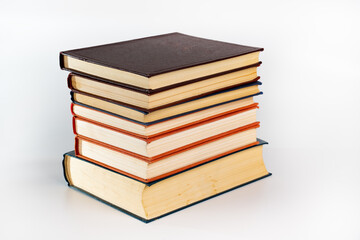 Stack of many different books isolated on white. Old books vintage top each over on white background. Collection aged book concept.