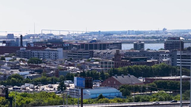 Aerial footage of cars driving on a highway over the Patapsco River in Baltimore Maryland USA