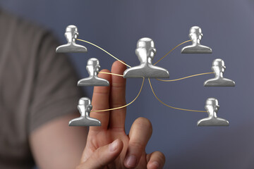 An image illustrating teamwork, digital connections, and networking through a visual representation of people linked together in a collaborative