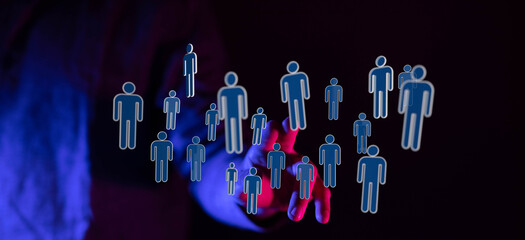 Abstract image of hand interacting with network of people icons, representing social networking,...