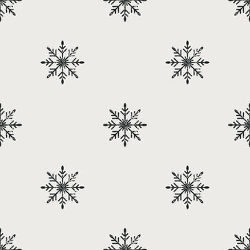 Seamless Christmas pattern. Grunge grainy snowflake texture. Festive endless vintage print. New Year's flat vector. For textile, wallpaper, wrapping design. Black snowflakes on white background.
