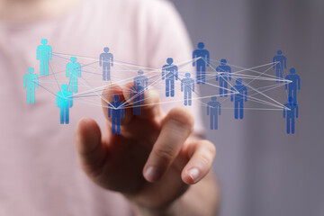 Hand touching digital network of people. Represents connection, communication, community, and global networks.  Ideal for business, technology,