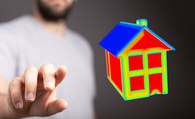 Man's hand pointing to a 3D rendered house model representing concepts like real estate, home ownership, mortgage, investment and dreams.