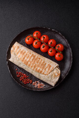 Shawarma with chicken or beef, tortilla roll, and vegetables. Shawarma with meat