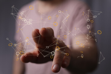 Human hand interacting with a digital network. Concept of connectivity, communication, internet, and futuristic technology. Global network and i