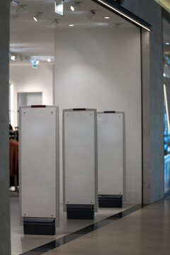 Radio-frequency security gates with integrated metal detector at a clothing store entrance