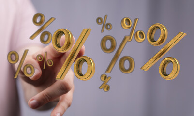 An image of a hand reaching towards several golden percentage symbols, representing financial concepts like discounts, interest rates, and marke