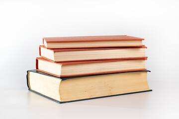 Stack of many different books isolated on white. Old books vintage top each over on white background. Collection aged book concept.