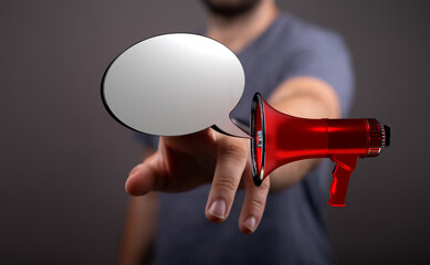 Image of a hand pointing with a red megaphone and speech bubble. Represents announcements,...