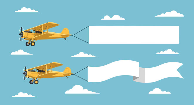 Two yellow airplanes flying with blank banners for advertising messages.