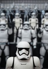 Naklejka premium tokyo, akihabara - sep 22 2025: A stormtrooper figure from George Lucas’s Star Wars spotlighted at Yodobashi Camera’s japanese pop culture floor with a shallow depth of field adding cinematic depth.