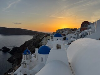 Sunset View of Blue Domes and White Houses in Oia, Santorini, Greece