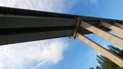 Close-up telephoto shots of the Asparuhov Bridge structure showing concrete elements, joints, bearings, frames, and construction details beneath the roadway