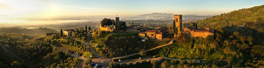 Italy, Idyllic small traditional towns of romantic Tuscany countryside. Picturesque borgo Buggiano hill top medieval village near Pienza. Panoramic view in morning loght
