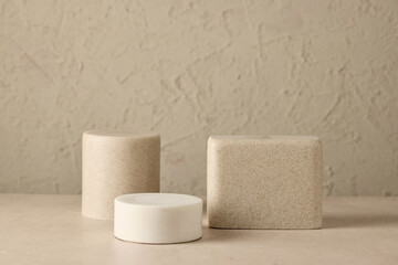 various podiums on beige background