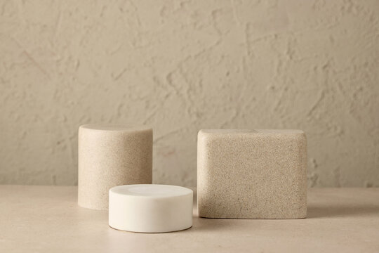 various podiums on beige background