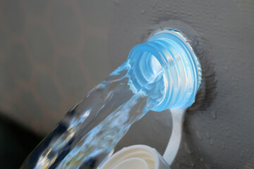 Draining water from open-air swimming pool. Water drains from frame pool