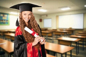 Portrait of happy graduate student holding  diploma