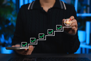 Step-by-step checklist concept toward goal achievement. Person marks completed tasks in digital workflow, symbolizing productivity, planning, goal setting, aspiration, milestone and success strategy.