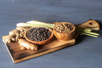 spices on a wooden chopping board.