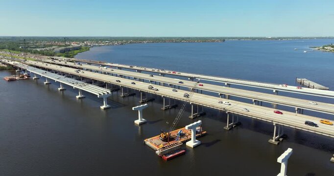 Industrial construction roadworks with new bridge spans being built in Ellenton, Florida. Development of interstate transportation