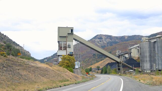 Coal mining industry with large conveyer across the road.in Gunnison national forest Colorado.