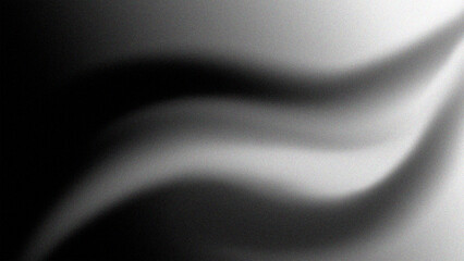 Abstract black and white gradient flowing fabric texture with subtle light reflections