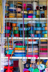 Colorful ribbons used for packaging sold outside on market stall