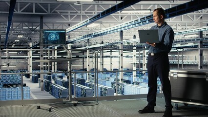 Data center technician investigates neural networks configuration, making adjustments to ensure...