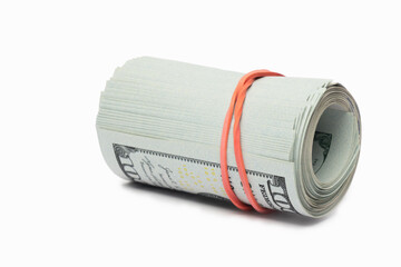 Roll of cash secured with a rubber band on a white background for financial purposes
