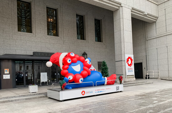 Osaka, Japan - Dec 26 2024: Statue of Myaku-Myaku with a Santa's Christmas cap, the official character of Expo 2025 Osaka Kansai, displayed at the entrance of Osaka City Hall