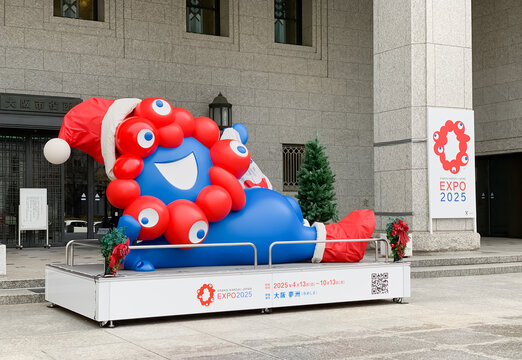 Osaka, Japan - Dec 26 2024: Closeup of statue of Myaku-Myaku with a Santa's Christmas cap, the official character of Expo 2025 Osaka Kansai, displayed at the entrance of Osaka City Hall