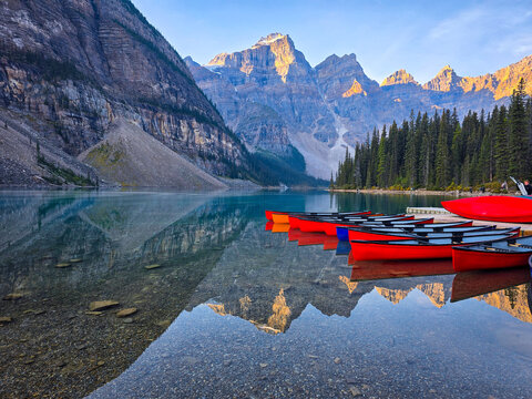 Moraine Lake, Banff National Park, Canada. A stunning summer landscape featuring the turquoise waters of Moraine Lake reflecting the dramatic peaks of the Valley of the Ten Peaks. 