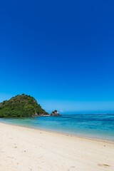 Lombok, Indonesia, Beach ocean landscape with unidentifiable people for surfing at Selong beach area. Lombok is an island in West Nusa Tenggara province, Indonesia.