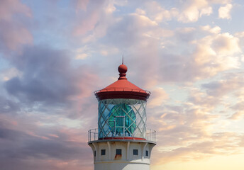 The Kilauea Point lighthouse features a second-order, bivalve (or clamshell) Fresnel lens seen at sunrise. This powerful, four-ton lens is made of 400 prisms, has a diameter of 55 inches. Kauai, HI. © LoweStock