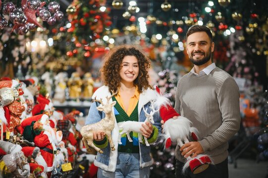 Happy couple shopping christmas holiday decorations