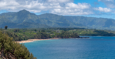Fototapeta premium View of the north coast of the island of Kauai from Kilauea Point to Princeville and Hanalei. A sweeping panorama that includes the rugged, green cliffs of the Nāpali Coast in the distance.