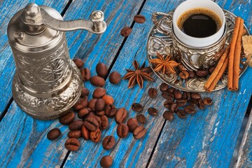 Old metal bowl with aroma coffee beens