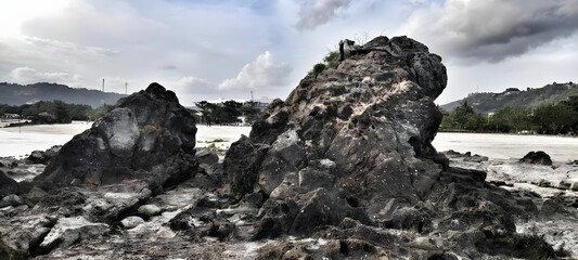 Rugged Coastal Rocks Under a Dramatic Sky A Serene Natural Landscape