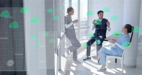 Co-workers in scrubs chatting in lounge holding mugs, with binary code, green cloud icons on glass