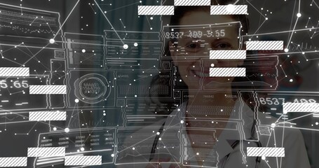 Showcasing female doctor analyzing digital panels in clinical hallway, with stethoscope, eyeglasses