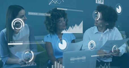 Reviewing reports, three professionals collaborating in office lounge with laptop, floating charts