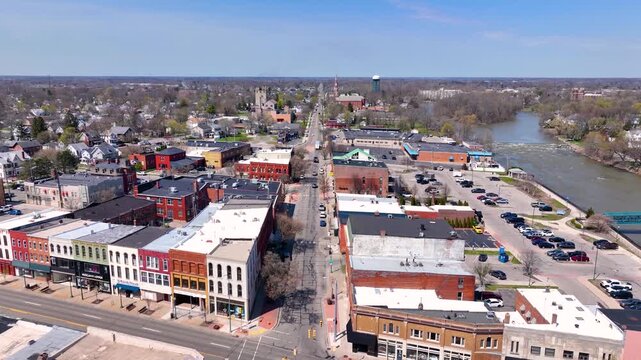 Martin Luther King bridge over River Raisin and Historic residential buildings aerial view on E Elm Avenue in historic downtown Monroe, Michigan MI, USA. 