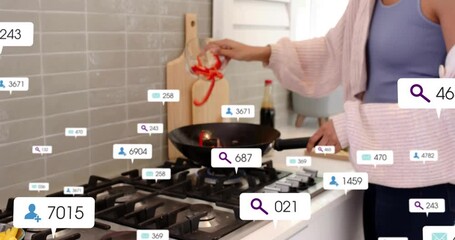 Hand entering grabbing bowl cook pouring red peppers and yellow fruit into wok for cooking stir-fry - Powered by Adobe