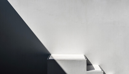 One sharp white concrete stair edge with a crisp cast shadow cutting diagonally from top-left; vast blank wall filling the frame, 70% negative space on the right. Hard noon light for graphic contrast,