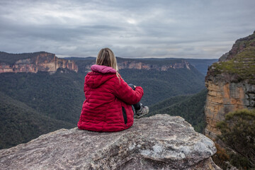 Adult hiker relaxing on rock Blue Mountains views