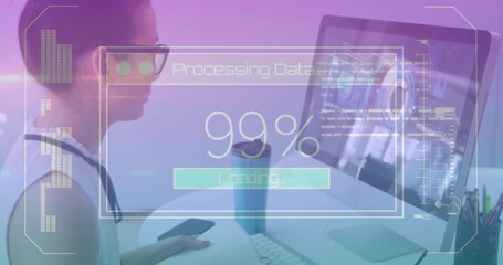 woman monitoring processing data overlay loading to hundred percent on monitor and jotting notes - Powered by Adobe