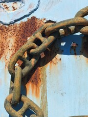 Rusty Industrial Chain on Weathered Metal Surface